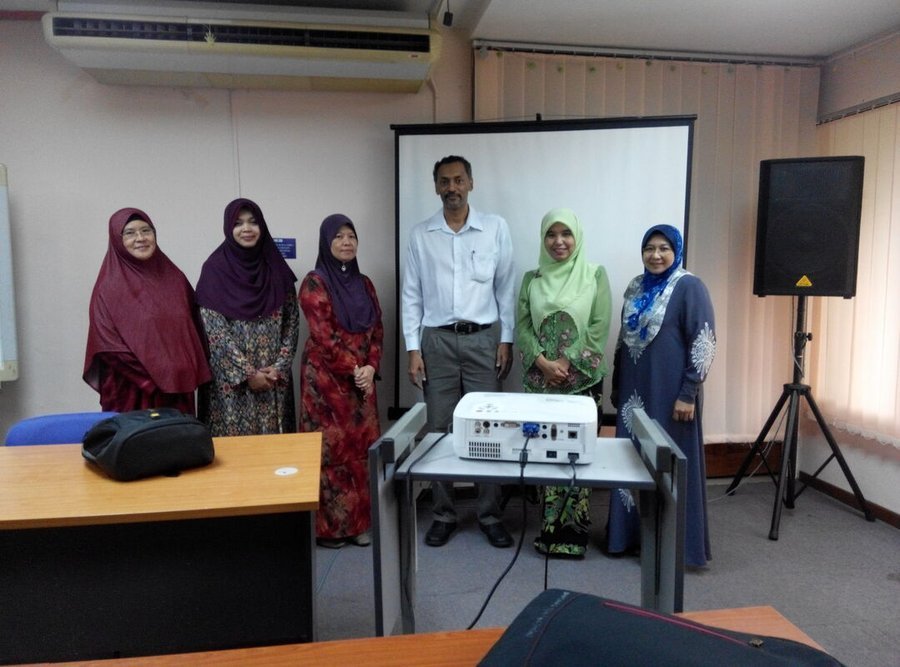 Participants and Palani Murugappan posing together after a training session