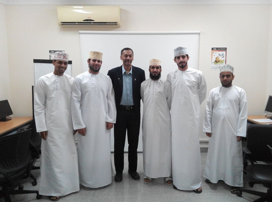 Palani Murugappan with participants after delivering a training session in Oman